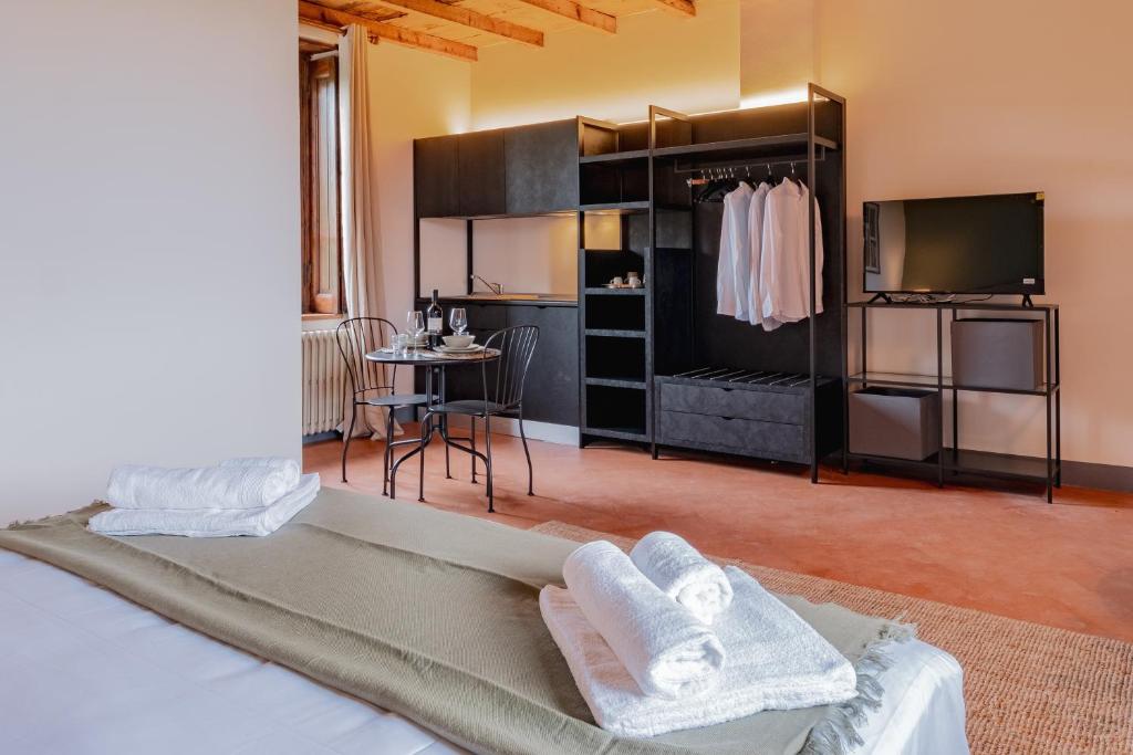 Postel nebo postele na pokoji v ubytování Relais Macconago