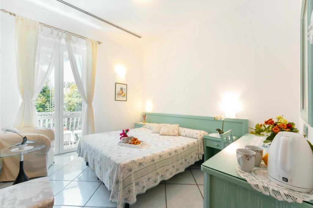 Letto o letti in una camera di La Vispa Teresa