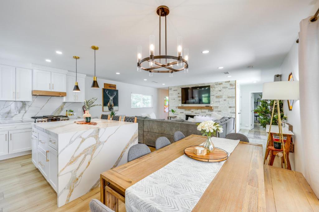 a kitchen and dining room with a wooden table and a dining room at Walk to The Village ShopsandEats Big Bear Lake Home in Big Bear Lake
