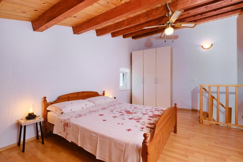 Postel nebo postele na pokoji v ubytování Domus Olivae