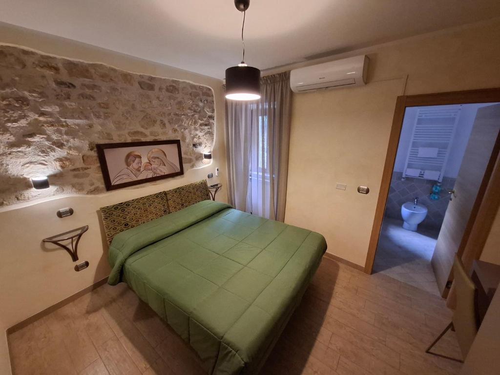 Postel nebo postele na pokoji v ubytování Antico Mulino di Cascia