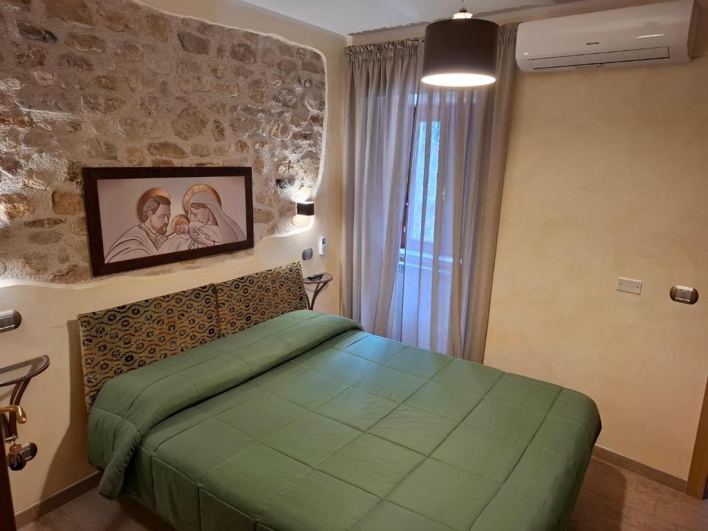 Postel nebo postele na pokoji v ubytování Antico Mulino di Cascia