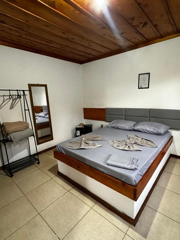 Postel nebo postele na pokoji v ubytování Chalés