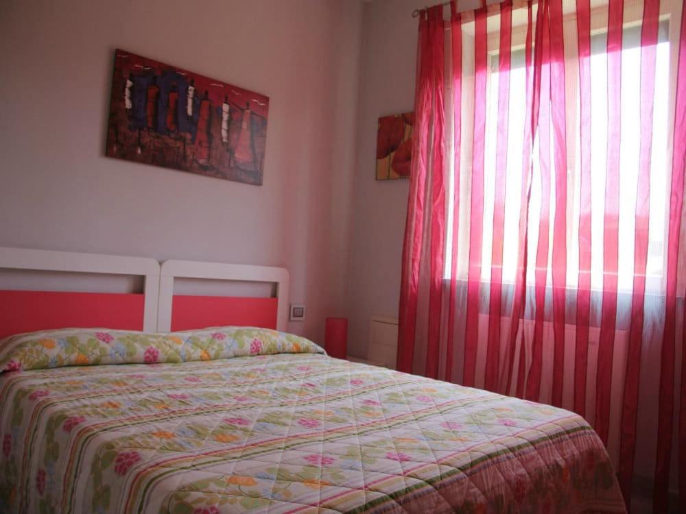 Postel nebo postele na pokoji v ubytování Rosta Residence Ranverso