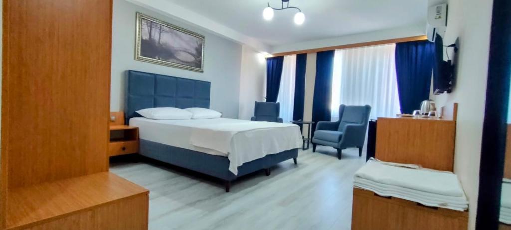 Postel nebo postele na pokoji v ubytování Lantis Otel