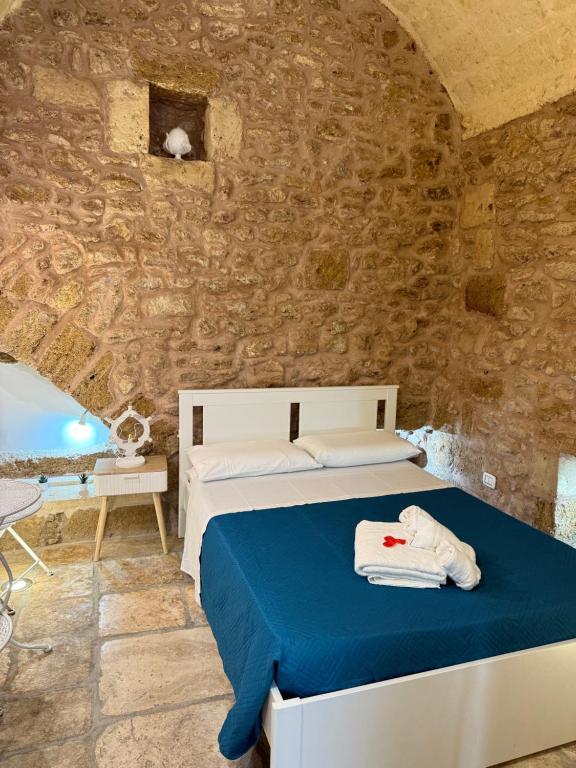 A bed or beds in a room at Agrimi b&b