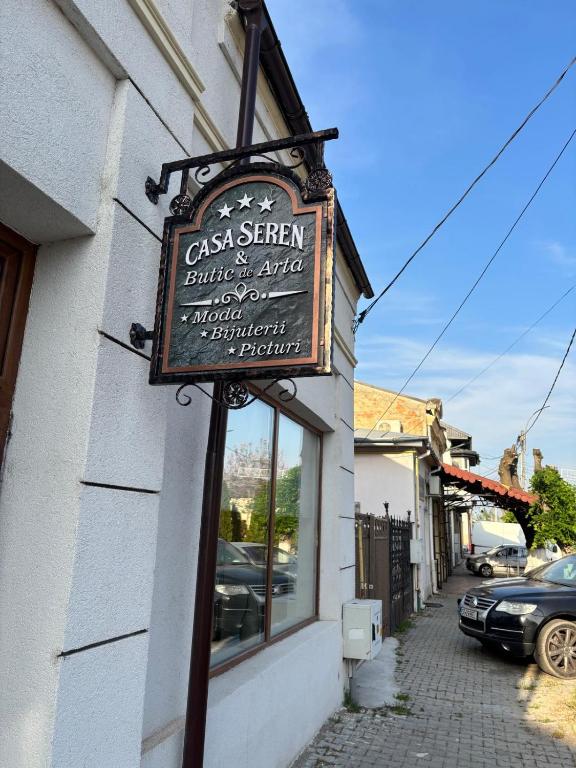 a sign for a restaurant on the side of a building at Casa Seren in Corabia
