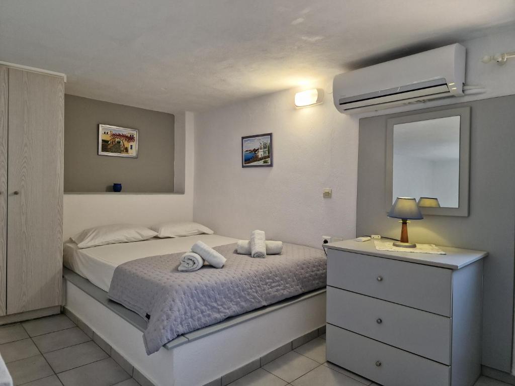 Postel nebo postele na pokoji v ubytování Porto Apergis