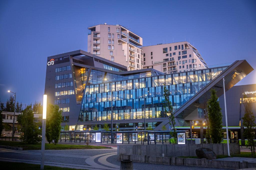 a large office building with a lot of windows at GrandApart Olsztyn centrum in Olsztyn