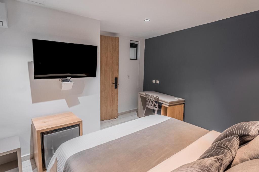Postel nebo postele na pokoji v ubytování Hotel Plaza Doce