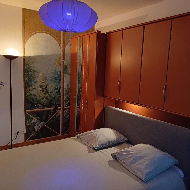 Postel nebo postele na pokoji v ubytování La clef des cœurs