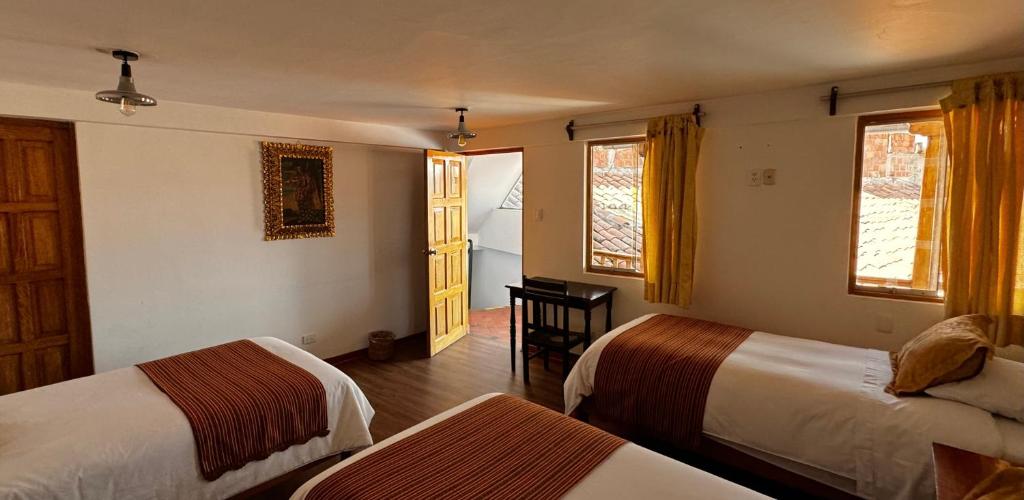 Rúm í herbergi á Huascaran Casa Boutique San Blas