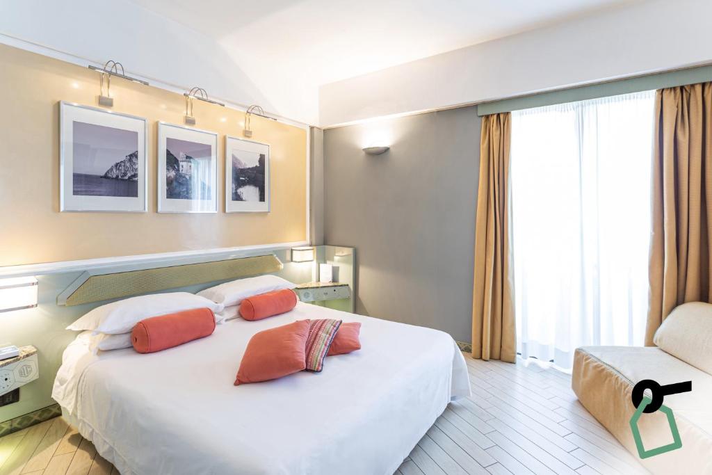 Postel nebo postele na pokoji v ubytování HOTIDAY Room Collection - Circeo