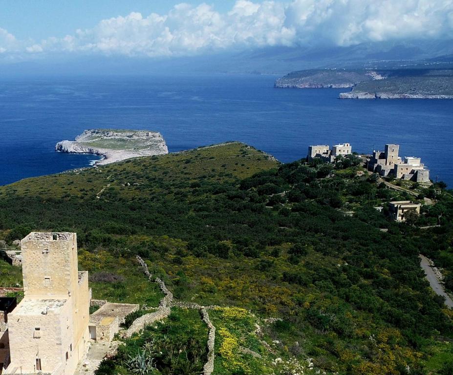 an aerial view of a castle on a hill next to the ocean at Mani Fort Charabos in Stavríon