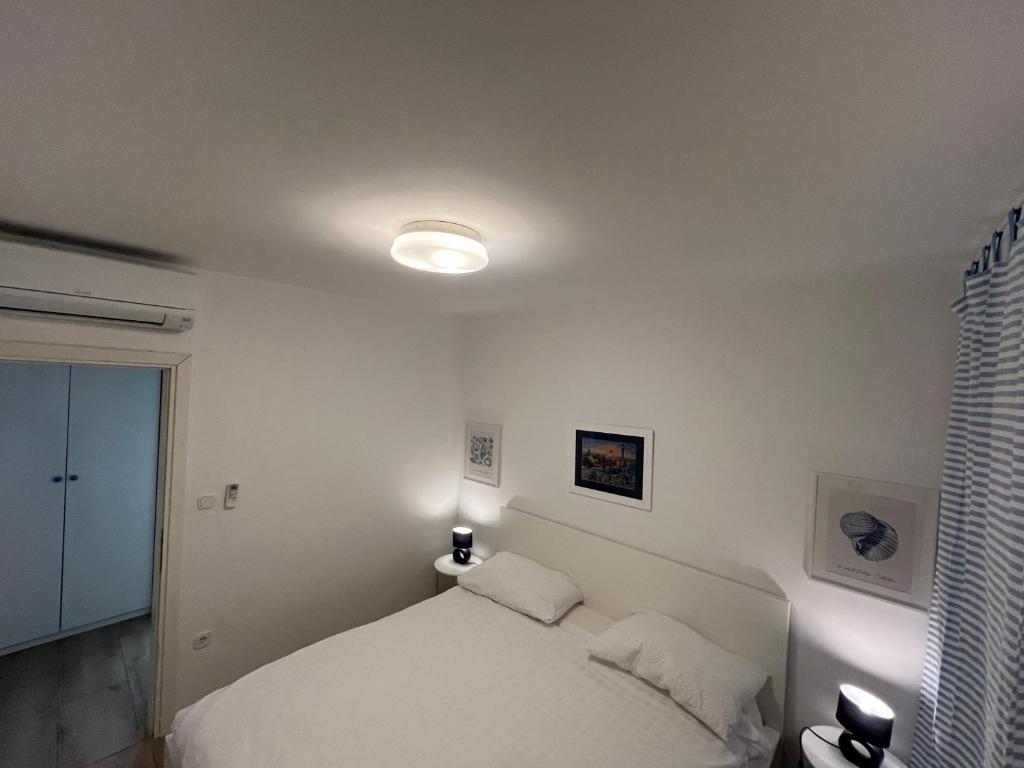 Postel nebo postele na pokoji v ubytování Apartments Selce