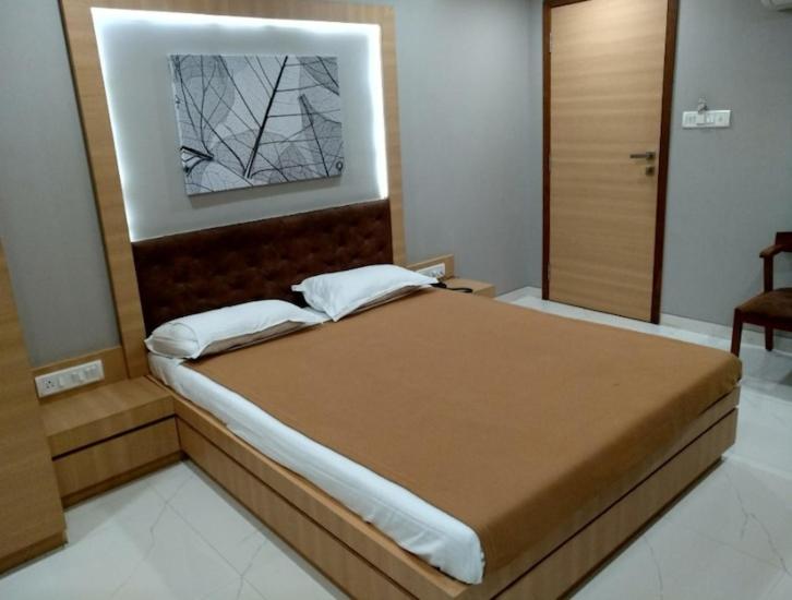 Postel nebo postele na pokoji v ubytování Gtois TIRUPATI