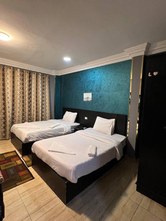 Postel nebo postele na pokoji v ubytování Beko pyramids inn
