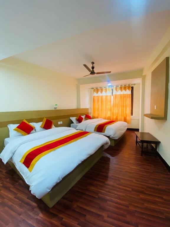 Postel nebo postele na pokoji v ubytování Hotel Nur