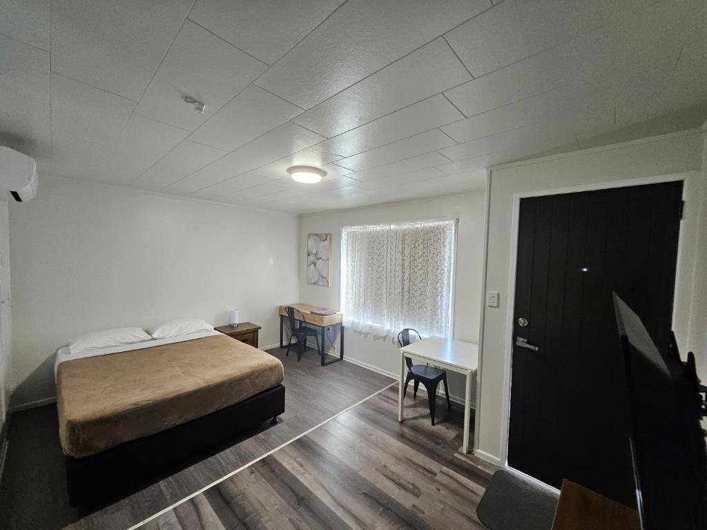Postel nebo postele na pokoji v ubytování Rockfield Motel