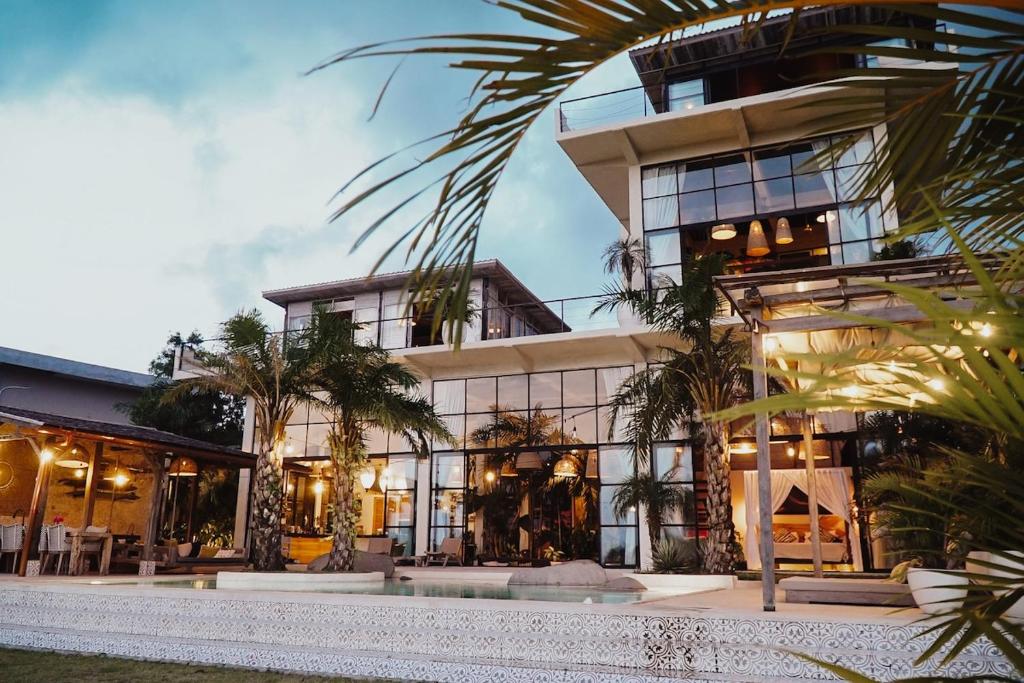 a large building with a lot of windows at The Castle Uluwatu - Ocean View Luxury villa in Uluwatu