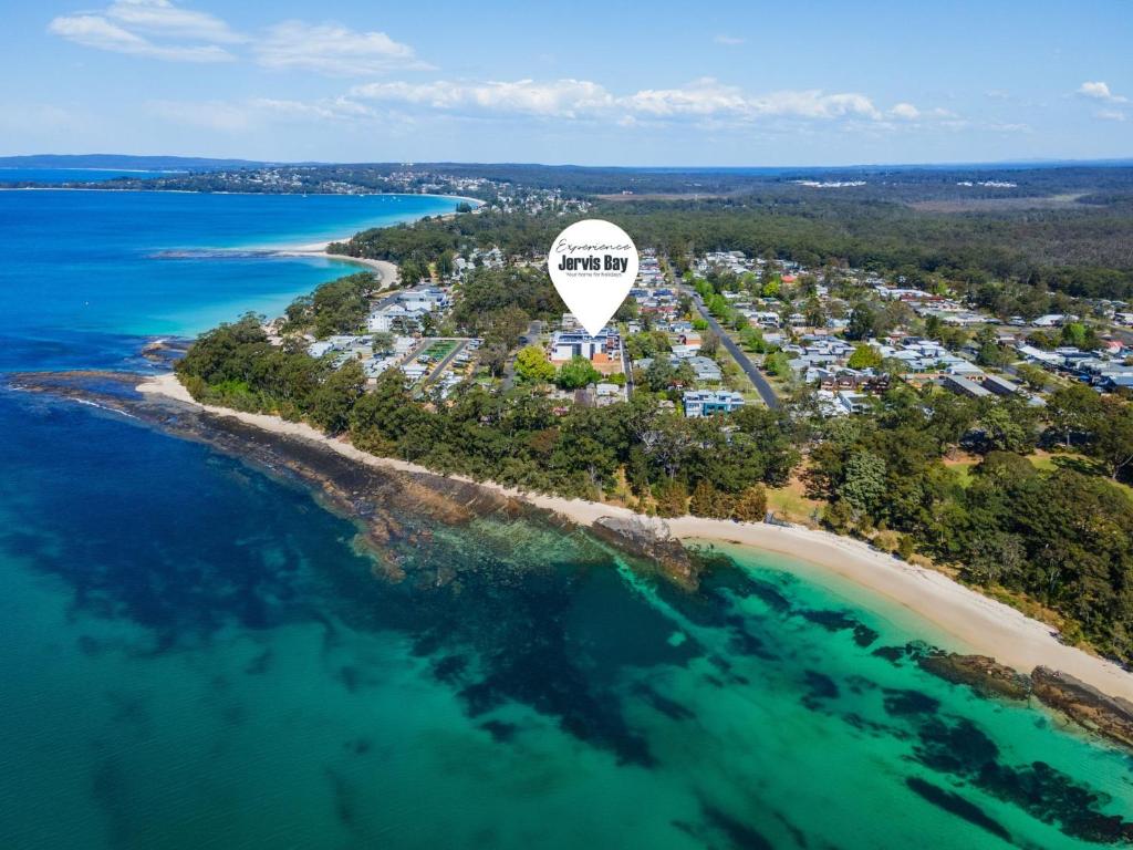 an aerial view of an island with a hot air balloon at Allura Blue by Experience Jervis Bay in Huskisson