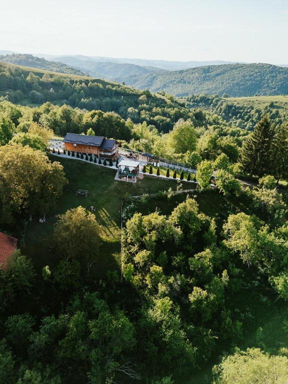 an aerial view of a house in the middle of a forest at La Mosie-Ruda in Ruda