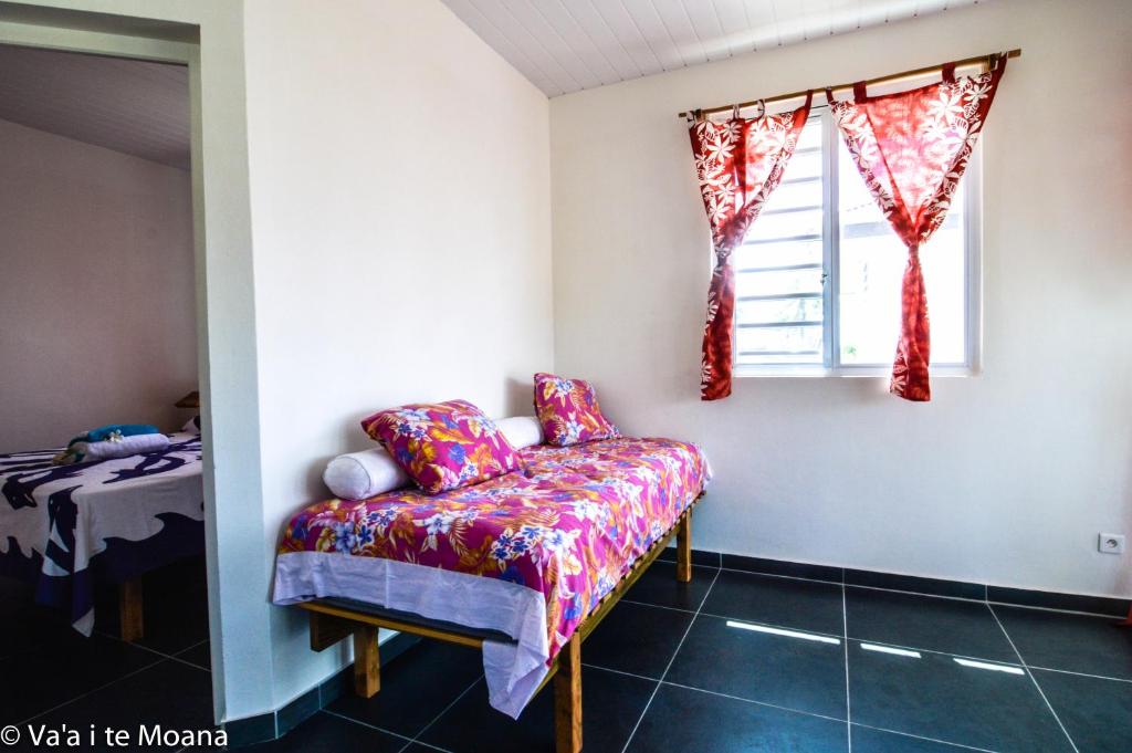 Uma cama ou camas num quarto em Va'a i te Moana