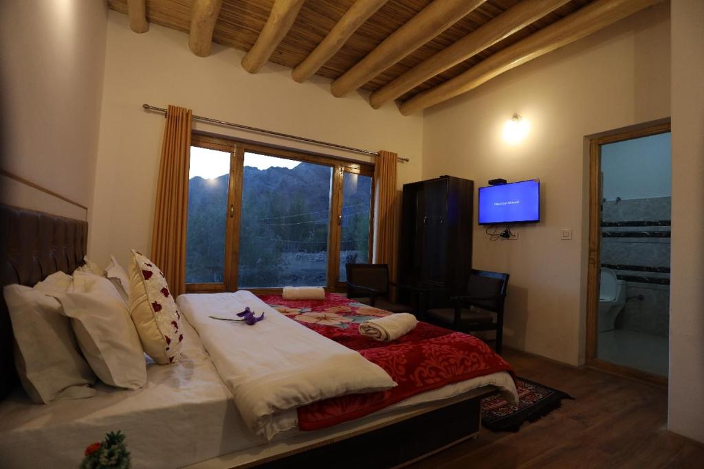 Postel nebo postele na pokoji v ubytování Stanzin Manepa Homestay