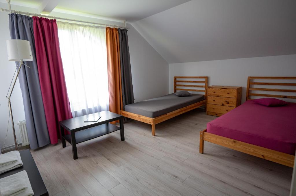 Postel nebo postele na pokoji v ubytování ViiLa TO
