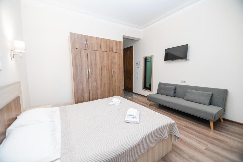 Postel nebo postele na pokoji v ubytování Hotel Mireosi
