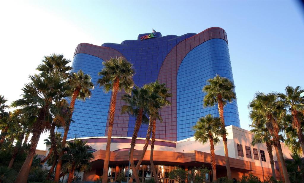 a building with palm trees in front of it at Rio Hotel & Casino in Las Vegas