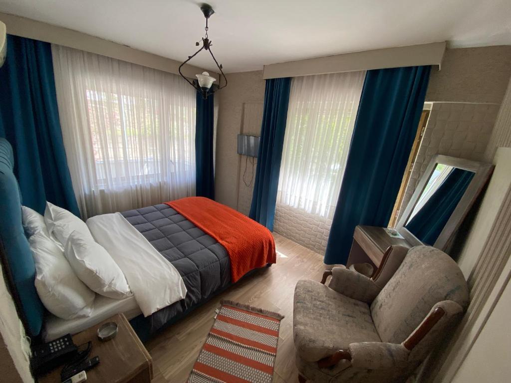 Postel nebo postele na pokoji v ubytování EVİM APART HOTEL