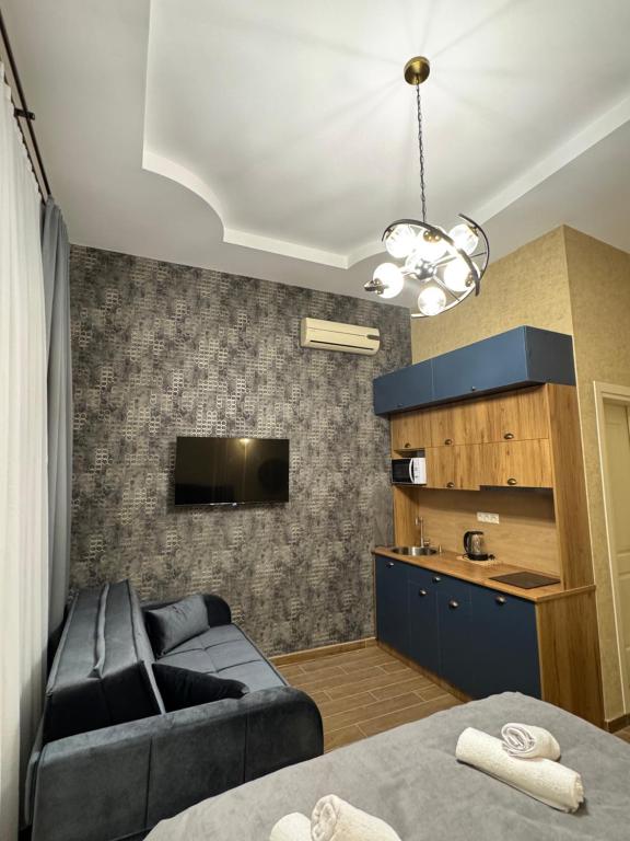 TV a/nebo společenská místnost v ubytování Albatross Luxe Hotel