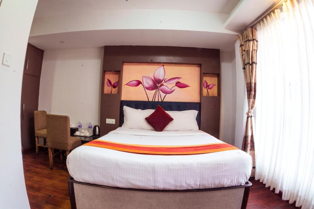 Postel nebo postele na pokoji v ubytování Hotel Kathmandu square