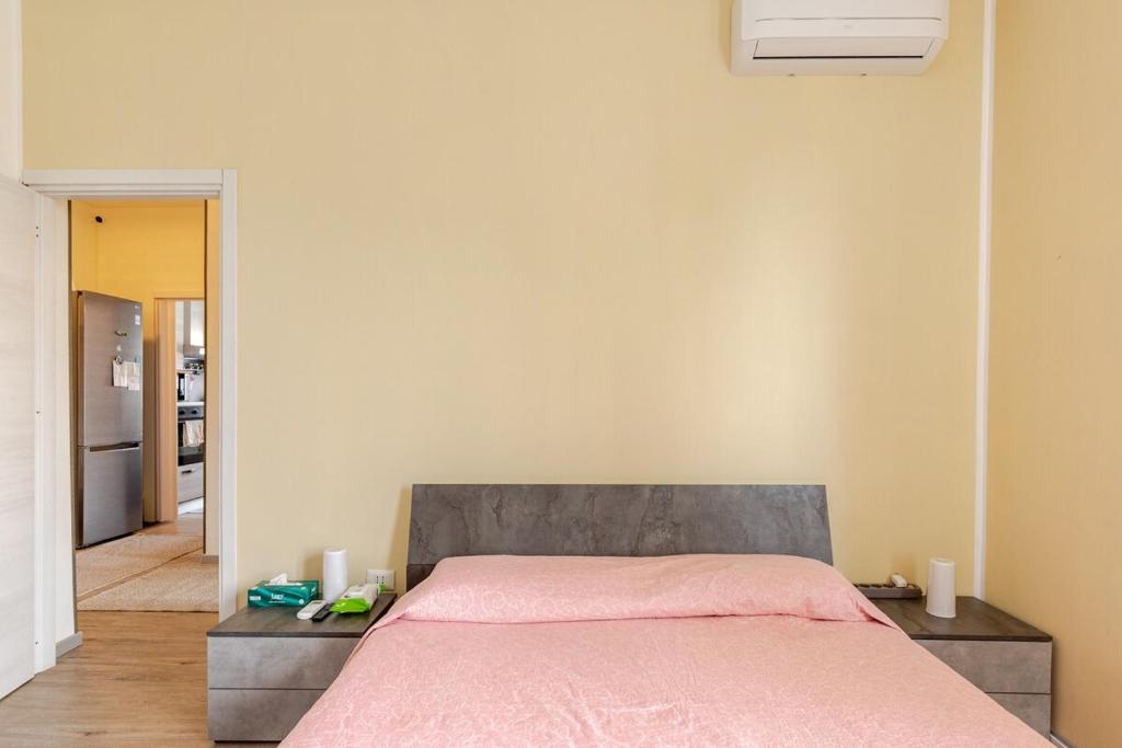 Postel nebo postele na pokoji v ubytování Stanza Dima