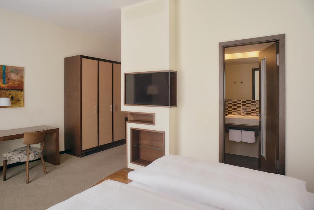 Postel nebo postele na pokoji v ubytování Aparthotel am Golfclub Treudelberg