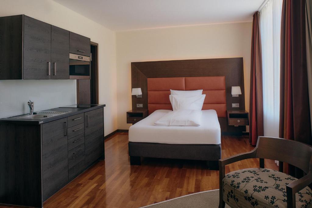 Postel nebo postele na pokoji v ubytování Aparthotel am Golfclub Treudelberg