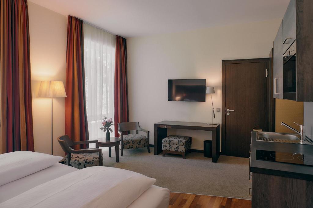 Postel nebo postele na pokoji v ubytování Aparthotel am Golfclub Treudelberg