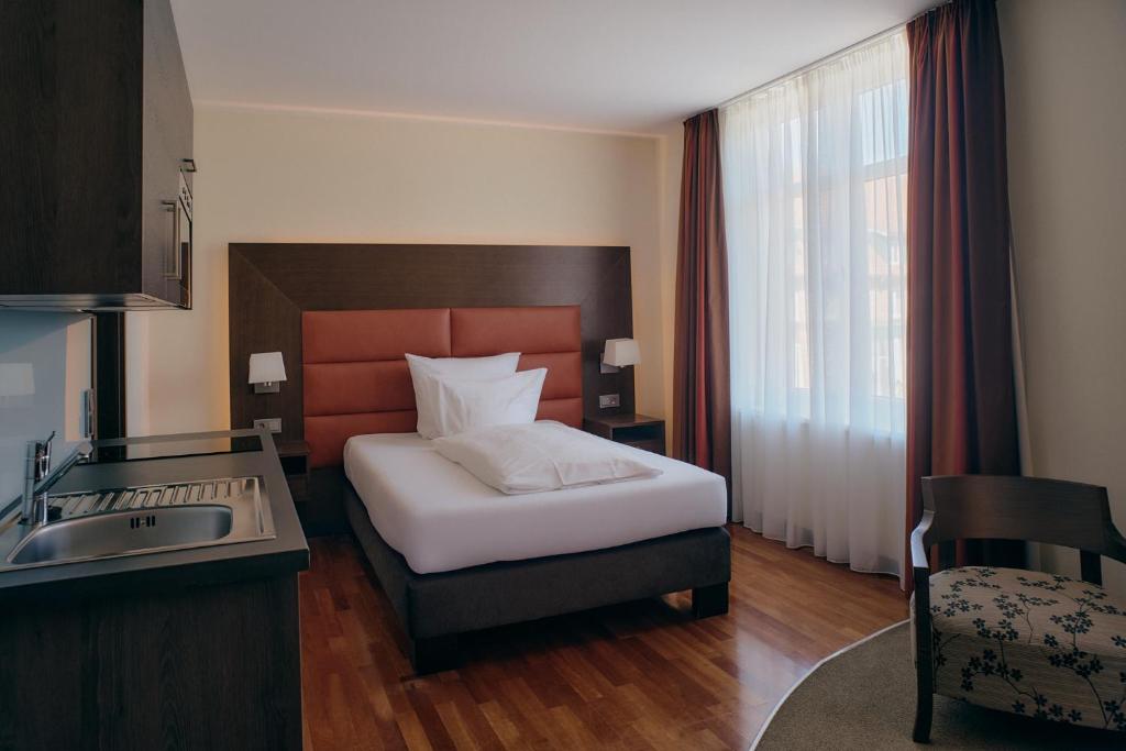 Postel nebo postele na pokoji v ubytování Aparthotel am Golfclub Treudelberg
