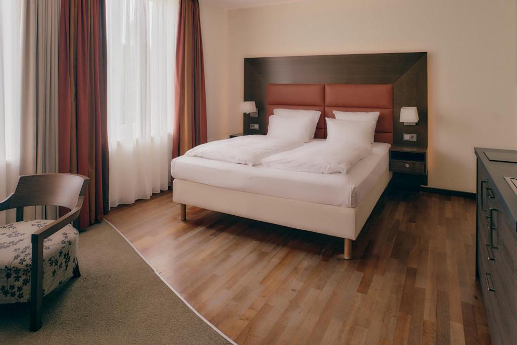 Postel nebo postele na pokoji v ubytování Aparthotel am Golfclub Treudelberg