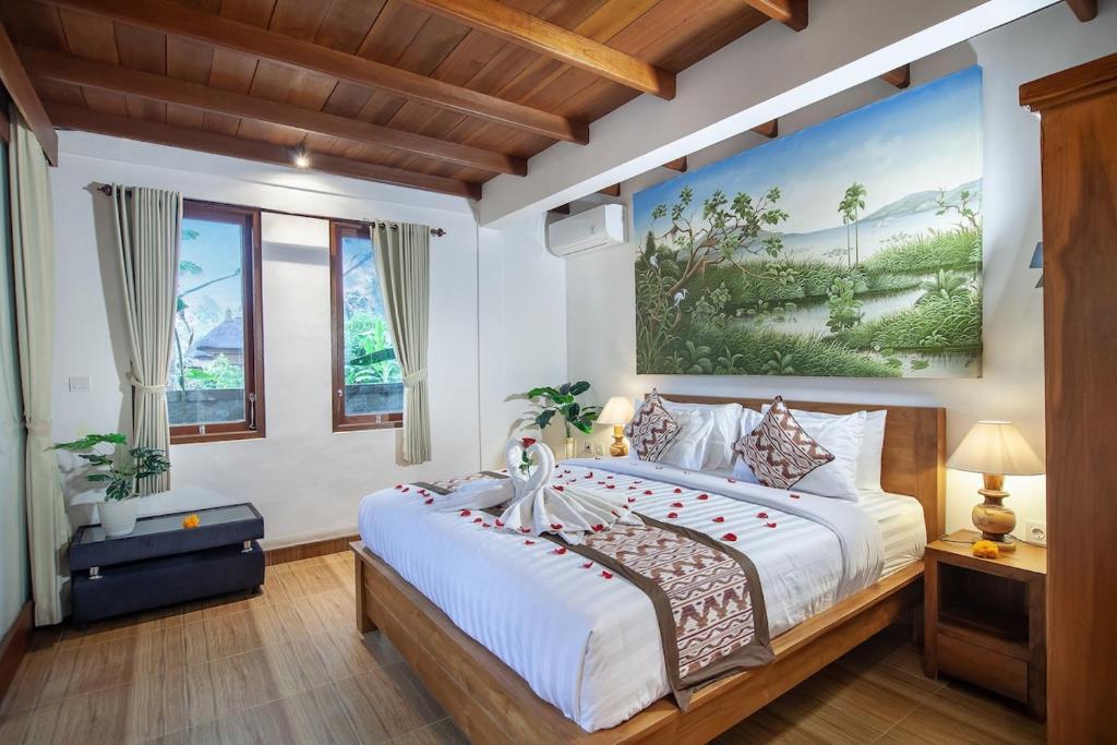 Ένα ή περισσότερα κρεβάτια σε δωμάτιο στο De Artha Guest House Private pool