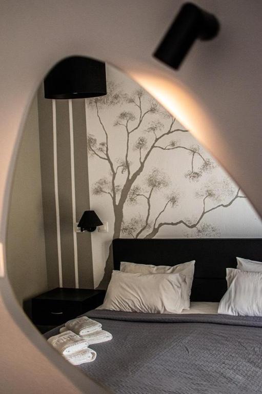 Postel nebo postele na pokoji v ubytování Hotel Kalloni