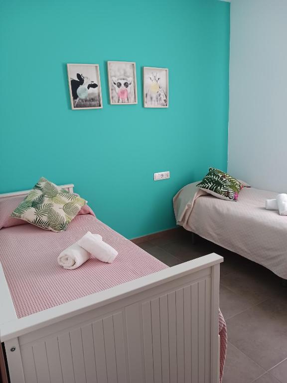 Postel nebo postele na pokoji v ubytování Piso arquillo del reloj