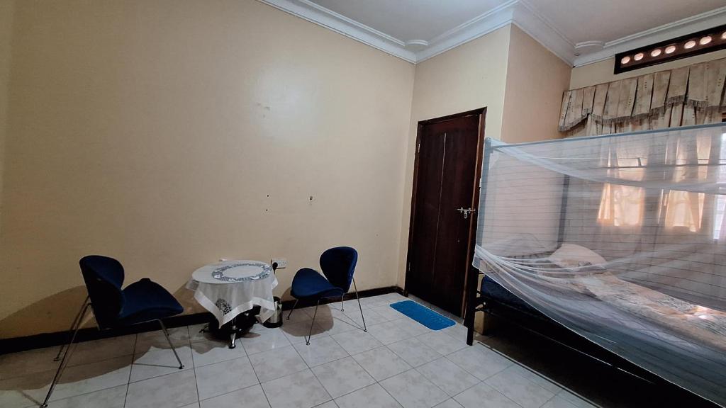 Postel nebo postele na pokoji v ubytování Jambula Rest Homes