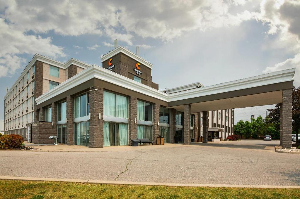 a large office building with a large building at Comfort Inn & Conference Centre Toronto Airport in Toronto