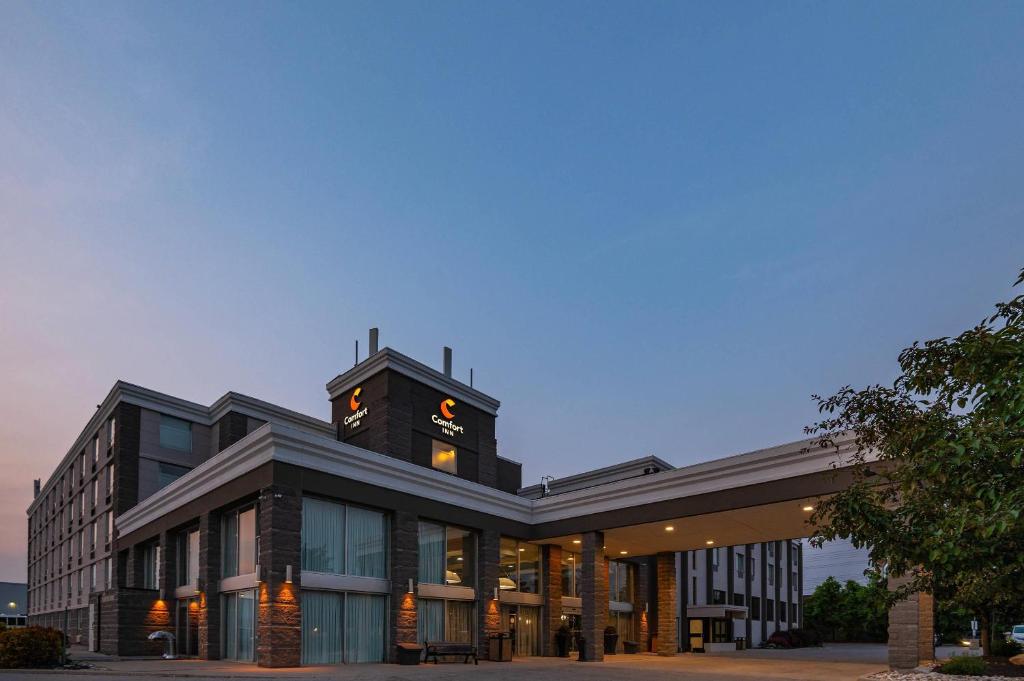 a building with a clock tower on top of it at Comfort Inn & Conference Centre Toronto Airport in Toronto