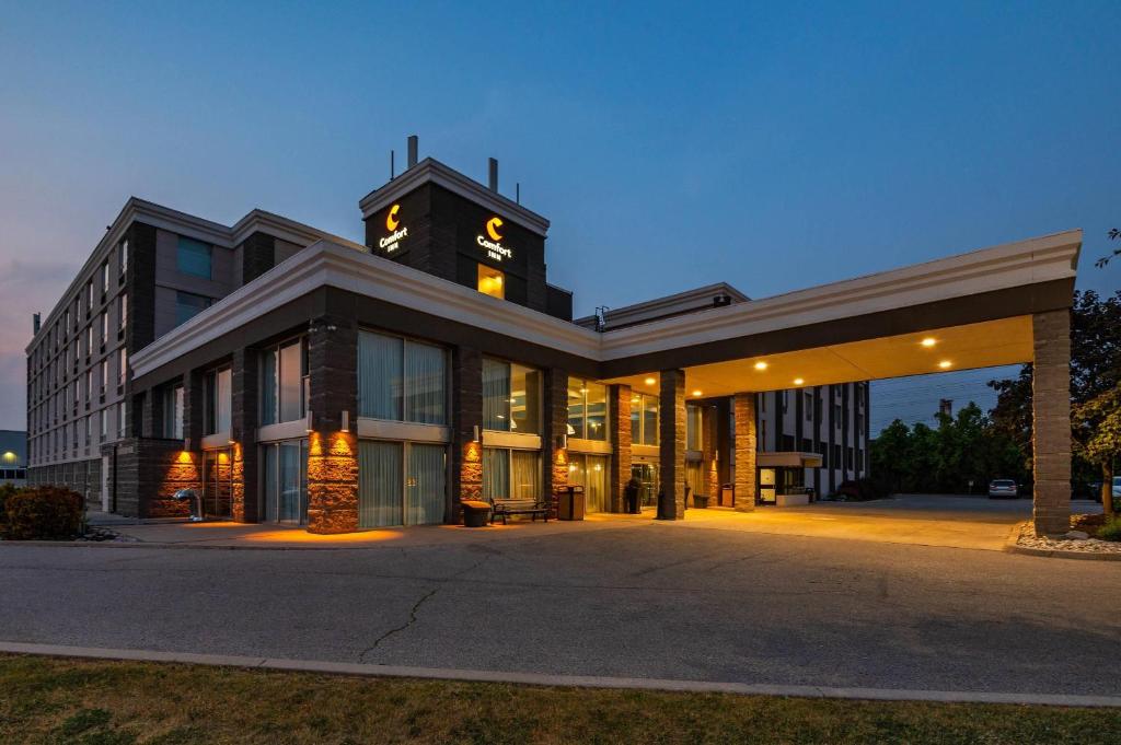 a large building with a clock tower on top of it at Comfort Inn & Conference Centre Toronto Airport in Toronto