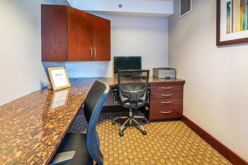 an office with a desk with a chair and a computer at Comfort Inn & Conference Centre Toronto Airport in Toronto