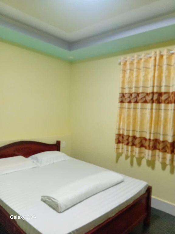 Postel nebo postele na pokoji v ubytování HoTel MoTeL ĐỒNG KHỞI