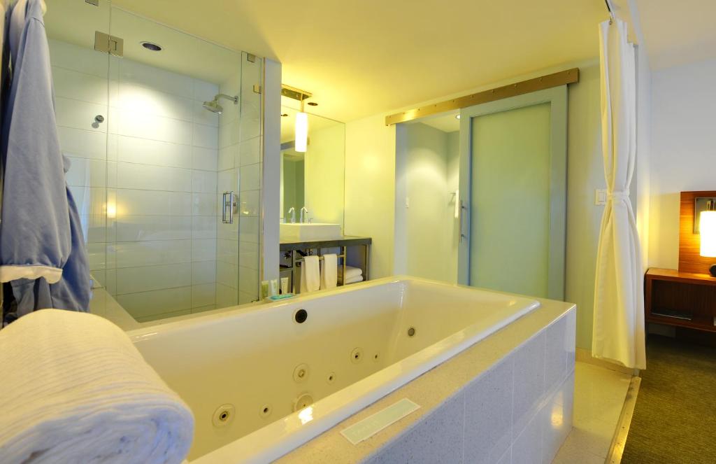 a large bathroom with a tub and a shower at Tower 23 Hotel in San Diego